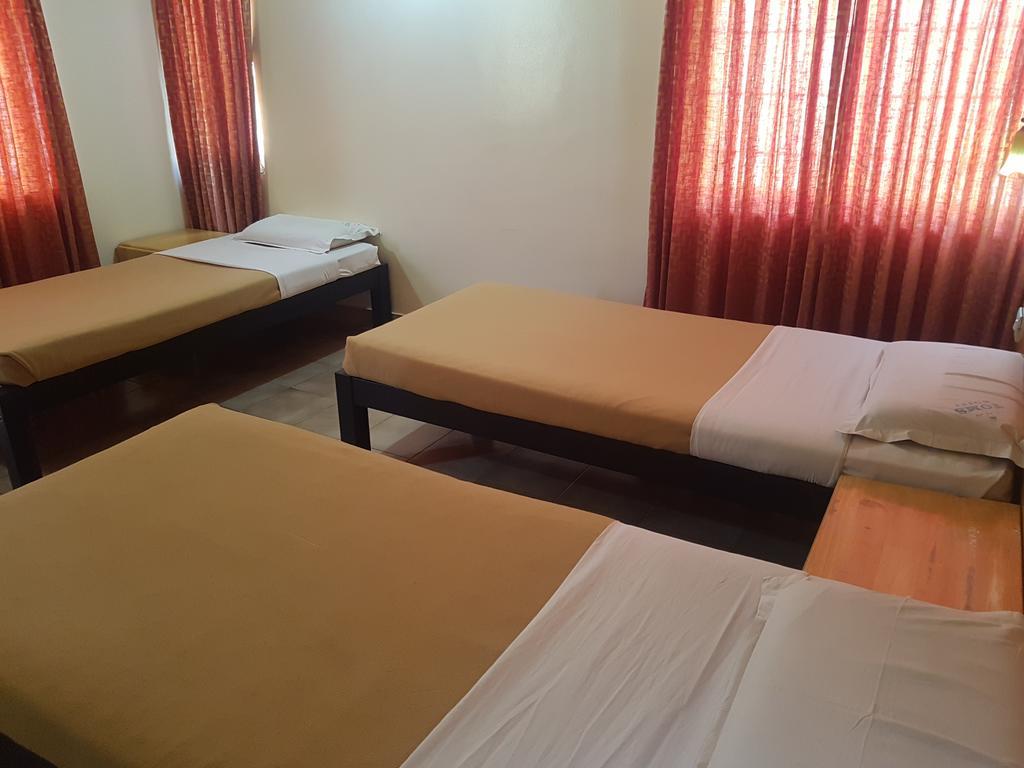 Tom'S Hotel Bangalore Bagian luar foto