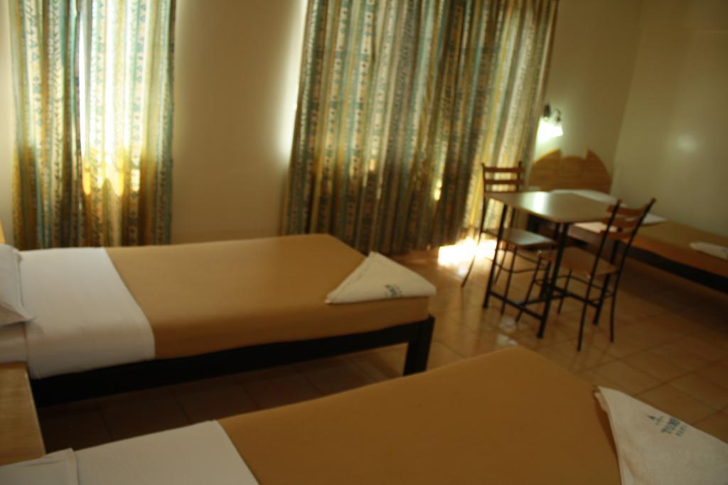 Tom'S Hotel Bangalore Bagian luar foto